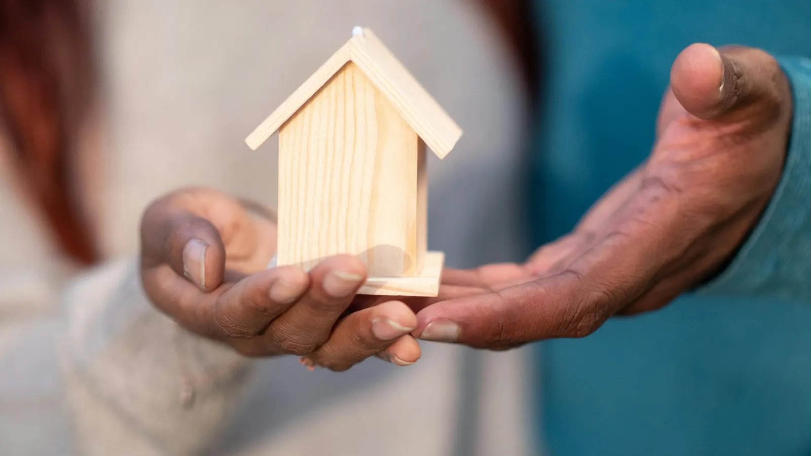Home buyers signing a property contract